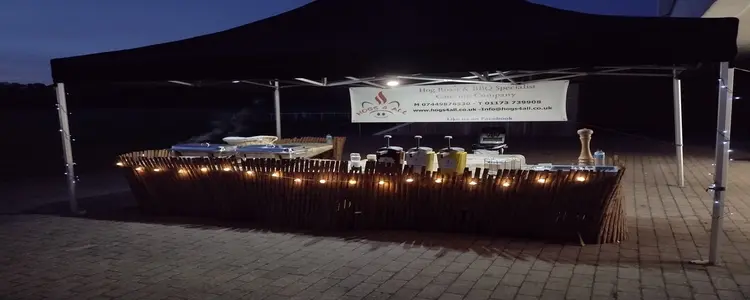 Corporate Christmas catering setup with hog roast and BBQ